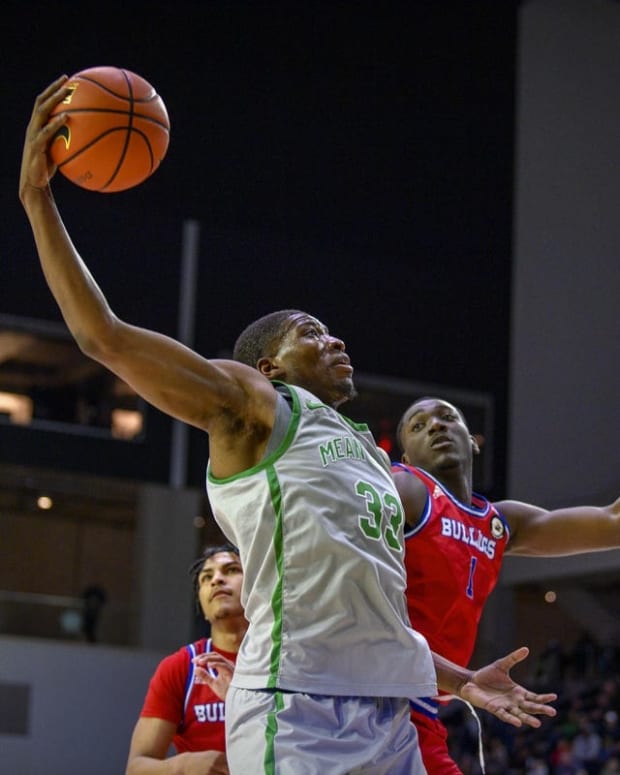 Mar 11, 2022; Frisco, TX, USA; North Texas Mean Green forward Abou Ousmane (33) drives to the basket past Louisiana Tech Bulldogs forward Kenny Hunter (1) during the second half of the men s basketball semi-finals of the USA Conference Tournament at Ford Center at The Star. Mandatory Credit: Jerome Miron-USA TODAY Sports